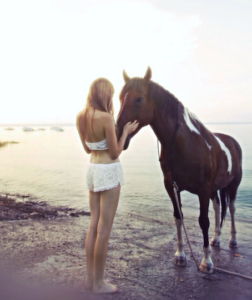 woman & horse on beach